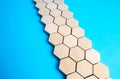 Chain of hexagons on a blue background. Moving forward. Abstraction. Structure, hierarchy. The concept of organization and