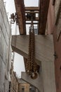 Chain hoist for lifting weights in an old factory Royalty Free Stock Photo