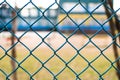 Chain-link of blue color close-up, background is blured Royalty Free Stock Photo