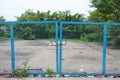 Chain link fence and metal door with lock. Royalty Free Stock Photo