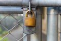 Chain link fence and metal door with lock Royalty Free Stock Photo