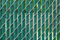 Chain link fence with privacy slats Royalty Free Stock Photo