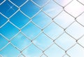 Chain link fence see blue sky Royalty Free Stock Photo