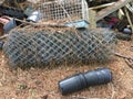 Chain Link fencing, Planting Pots & an Animal Cage thrown in a pile Royalty Free Stock Photo