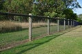 Chain link mesh wired wooden gate Royalty Free Stock Photo