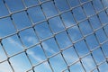 Chain Linked Fence with Blue Sky Background Royalty Free Stock Photo