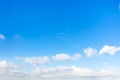 Chain of little cumuli clouds in blue sky