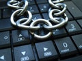 Chain and lock on laptop keyboard. Computer ban, internet ban. Addiction. Anti virus Royalty Free Stock Photo