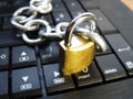 Chain and lock on laptop keyboard. Computer ban, internet ban. Addiction. Anti virus Royalty Free Stock Photo