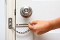 Chain lock and knob lock in door Royalty Free Stock Photo