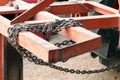 Chain old attached to a steel frame, Chain for towing, Binding bound with iron chains, The bond with steel chains Royalty Free Stock Photo