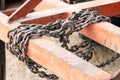 Chain old attached to a steel frame, Chain for towing, Binding bound with iron chains, The bond with steel chains Royalty Free Stock Photo