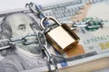 Chain and padlock around dollar bundle Royalty Free Stock Photo