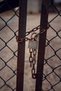 Chain and padlock hanging on an old rusty gate Royalty Free Stock Photo