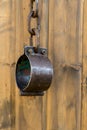 Chain shackles old forged weather-beaten traditional way to contain criminals and slaves on a wooden background Royalty Free Stock Photo