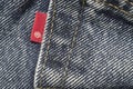 Closeup detail of levi`s red tag on levi `s jeans.