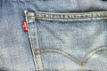 Closeup detail of levi `s red tag on levi `s jeans.