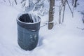 Chained Garbage barrel in winter
