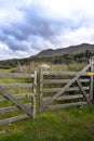 Chained gate to mountains Royalty Free Stock Photo
