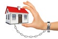 Chained hand holding house Royalty Free Stock Photo