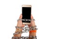 Chained hands holding a smartphone