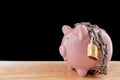 Chained piggy bank and lock money savings with chain and keys. Money security concept