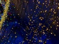 chains of light on a dark blue background resemble a starry sky at night. Royalty Free Stock Photo