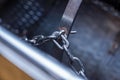 Chains of the modern grape press. Rotary drum and screw press for the vine in winery