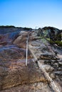 Chains on pathway to famous Kjeragbolten to help go up on climb steep cliffs. Norway