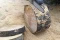 The chainsaw cuts wood. The log is large. The saw cut is wooden.