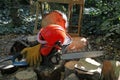 Chainsaw with protective gloves and helmet at woodwork place