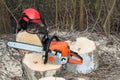 Chainsaw and protective safety equipment Royalty Free Stock Photo