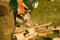 Chainsaw with sawdust Royalty Free Stock Photo