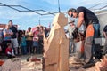 Chainsaw Sculptor Carves Dog Out Of Wood Royalty Free Stock Photo