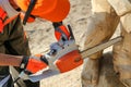 Chainsaw work on wood. Wood carving sculptures. Sawing firewood Royalty Free Stock Photo