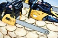 Chainsaws on wood in store Royalty Free Stock Photo
