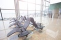 Chair Bench for passengers to set and wait at the airport near window Royalty Free Stock Photo