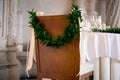 Chair for bride decorated with a wedding wreath