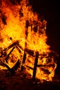 Furniture chair burning violently in a bonfire at night surreal fire elements