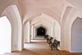 Chair in Empty corridor with handcarved pillars Royalty Free Stock Photo