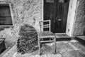 Chair and fisherman net by a rustic wall Royalty Free Stock Photo