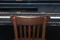 Chair in front of a retro piano