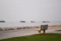 chair front of the sea with some ships