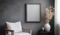 A chair is in front of a wall with a picture frame on it Royalty Free Stock Photo