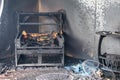 Chair and furniture in room after burned by fire in burn scene o Royalty Free Stock Photo