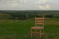 Chair on green grass cloudy sky in summer Royalty Free Stock Photo