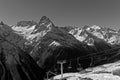 Chair lift and Belalakaya peak. The main Caucasian ridge. Dombai, Karachay-Cherkessia, Russia