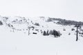 Chair lifts in ski center les arcs, paradiski on the french alps on a winter snowy day