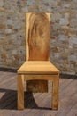 Chair made of solid wood on a stone background
