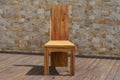 Chair made of solid wood on a stone background